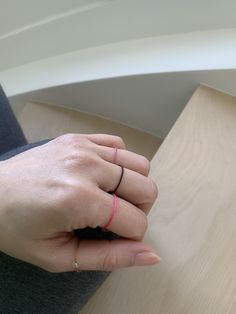 "Super chic, simple and unique! Available in 13 different colors! Makes a unique promise or pre-engagement ring for your exciting new journey! ♥︎ USA - Quick shipping 3-5 working days with tracking for only $5.95! ♥︎ D E T A I L S FEATURES: -Water resistant -Color does not fade easily -Adjustable -Comfortable to wear -Super unique! GEMSTONE AVAILABLE: -Clear quartz -Goldstone -Tiger Eye -Black Onyx -Amethyst -Each stone measures between 3-4mm MATERIAL: -Nylon string -Less than .8mm thick -Thicke Minimalist Adjustable Pink Stackable Rings, Minimalist Pink Rings For Everyday Wear, Minimalist Pink Rings For Everyday, Minimalist Everyday Pink Rings, Everyday Minimalist Red Rings, Pink Minimalist Midi Rings, Minimalist Pink Stackable Rings For Everyday, Minimalist Black Hypoallergenic Rings, Promise Ring Couple