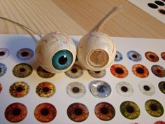 two eyeballs are sitting next to each other on a table