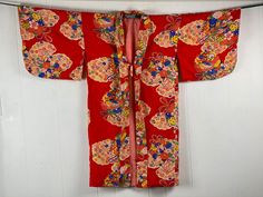 "Vintage 1940s silk kimono robe, can be worn as a jacket. Wonderful brilliant red field with festive floral print. Has a single tie below the bust line. Fully lined in pink silk. label reads: PURE SILK KATO BUSSAN SPECIAL SERVICES. About a size medium. Actual measurements: 51\" X 40\" hanging flat, or:  45\" around the chest  44\" around the waist  27\" shoulder seam to shoulder seam In excellent condition." Vintage Long Red Kimono, Vintage Red Long Kimono, Red Vintage Kimono For Spring, Vintage Red Kimono For Tea Ceremony, Vintage Floral Print Kimono, Vintage Long Floral Print Kimono, Seiden Kimono, Robe Silk, Kimono Vintage