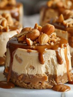 some desserts are on a white plate with peanut butter and caramel drizzle