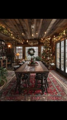 a dining room with christmas decorations and lights on the ceiling is decorated in rustic style