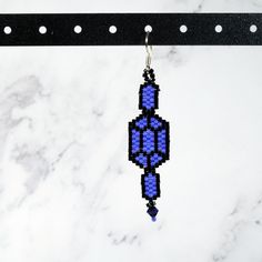 These beautifully beaded earrings are handcrafted with #11 Delica seed beads, which feature unsurpassed uniformity allowing for precise execution of design. These earring feature three rupees, two small and a large one in the middle, and are accented with Crystals for added sparkle. The dimensions are approximately 2.25 inches long by 0.5 inches wide. These are perfect for any Legend of Zelda fan! Colors may differ slightly depending on your screen and lighting. This pair of earrings is made-to- Faceted Beads Drop Earrings As Gift, Faceted Beads Drop Earrings For Gift, Gift Faceted Bead Drop Earrings, Traditional Faceted Beads Earrings For Gift, Gift Earrings With Round Black Beads, Legend Of Zelda, Beaded Earrings, Seed Beads, Swarovski Crystals