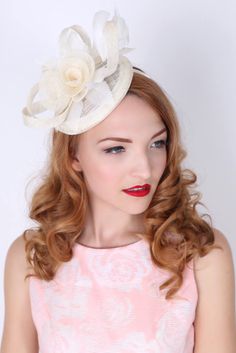 "\"Emelia Rose\" Black Fascinator This vintage-inspired fascinator is as timeless as a fairytale. Let your personality add life to its floral center and ribbon loop accents. It's round base and slip-on headband will allow you to look flawless and enjoy any event with ease! - Easy wear headband - Round sinamay base" Elegant Cream Headband For Spring, White Vintage Fascinator For Royal Ascot, Spring Cream Mini Hat Headband, Elegant Hair Accessories For Garden Party And Kentucky Derby, Elegant Cream Fascinator For Vintage Events, Adjustable Cream Headpiece For Garden Party, Adjustable Cream Headpieces For Garden Party, Elegant Beige Hair Accessories For Spring, Elegant Beige Headpieces With Handmade Flowers