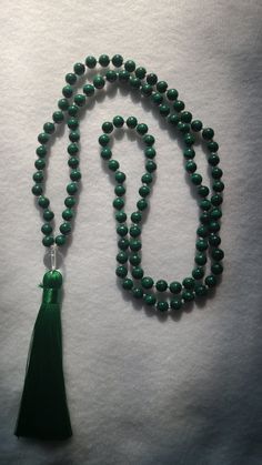 "Amazing handcrafted, quality and highly charged prayer beads for  focus, meditation, protection, and guidance. These beads were traditionally made with the \"rudraksha\" seeds, which are the seeds of an evergreen tree widely spread across India, as well as with sacred basil herbs, woods, or gemstones. Originally, mala beads are made of 108 beads and the largest bead in the center is also known as the \"guru\", which is said to encapsulate the energy created during the practice. There are several reasons as to why Malas are composed of 108 beads:  108 is the number related to the utmost important mantra, the \"Om\" The average distance of the moon from the Earth is roughly 108 times the diameter of the moon. Traditionally in ancient Indian numerology, one stands for God or higher Truth, ze Traditional Gemstone Beads Rosary For Meditation, Spiritual Rosary With Round Beads For Meditation, Spiritual Rosary For Meditation With Round Beads, Meditation Rosary With 108 Beads, Spiritual Rosary With 8mm Beads, Spiritual Hand-strung Rosary For Meditation, Holistic Hand-strung Mala For Meditation, Traditional Mala With Gemstone Beads For Healing, Natural Stone Rosary With Round Beads For Meditation