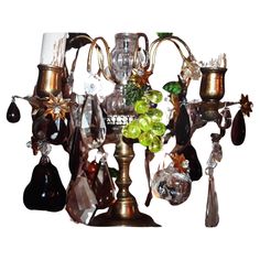 an assortment of glass and metal items hanging from a chandelier