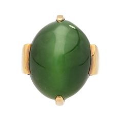 Cats Eye Gump Signed Ring in 14K Yellow Gold .  Invest in luxury with this vintage Gump signed dome solitaire ring, featuring a vivid green Cats Eye , shaped into an oval cabochon, and secured with a 4-prong setting. Crafted from 14K yellow gold, this ring features a geometric shape to its shank and base.   Item Details: - Type: Vintage Dome Ring  - Metal: 14K Yellow Gold  - Weight: 18.04 Grams  - Setting: Prong  _______________________  Center Stone Details: - Type: Cats Eye   - Cut: Cabochon, Heirloom Green Emerald Oval Cabochon Ring, Heirloom Green Oval Cabochon Emerald Ring, Formal Green Cabochon Rings, Elegant Domed Emerald Ring, Luxury Oval Green Dome Ring, Formal Green Oval Signet Ring, Green Oval Heirloom Signet Ring, Heirloom Green Oval Signet Ring, Green Cabochon Dome Ring For Formal Occasions