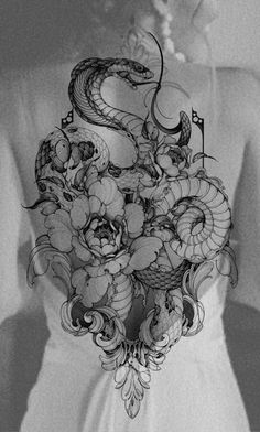 a woman wearing a white shirt with a tattoo design on it's chest and back