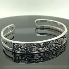 Men's Handmade Embroidered Bracelet , Handmade Cuff Bracelet , Silver Cuff Bracelet , Unisex Handmade Bracelet , 925k Silver Bracelet ★Item Details * Material : 925K Sterling Silver * Total weight : 24 Grams ✔ Ready to Ship in 1-2 Business Days .. ✔ Shipped to the Worldwide 1-5 business days with free shipping... ✔ The product will be sent to you with a handmade wooden box to avoid any damage during shipping... ✔ Visit our store, browse other Men's jewelry, silver and gold collections, and find Engraved Sterling Silver Adjustable Cuff Bracelet, Engraved Adjustable Sterling Silver Cuff Bracelet, Cuff Bracelet Silver, Embroidered Bracelet, Handmade Wooden Boxes, Cuff Bracelets Handmade, Gold Collection, Handmade Bracelet, Silver Cuff Bracelet