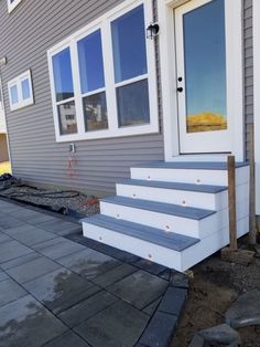 a house with steps leading up to the front door