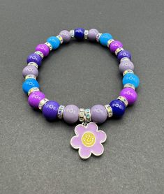 Crafted with meticulous care and attention to detail, this Handmade Happy Flower Glass Beaded Charm Bracelet is a vibrant and colorful addition to any jewelry collection. Perfect for adding a touch of flash to any outfit, this bracelet is not only a stylish accessory but also a thoughtful gift idea for those who love wearing color. Embrace individuality and showcase your personality with this one-of-a-kind beaded bracelet that exudes charm and sophistication. Ideal for those who appreciate handc Money Making Hacks, Happy Flowers, Handmade Glass Beads, Bead Charm Bracelet, Stretchy Bracelets, Stylish Accessories, Bracelet Sizes, Charm Jewelry, Bead Charms