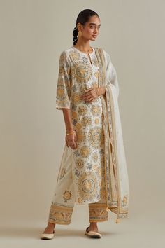 Yellow and off-white cotton chanderi straight kurta with side pockets and silk thread, mirror, sequins, tassels and braids embroidered patchwork. Comes with cotton straight pant, a dupatta and a slip. - Aza Fashions Off White Cotton Traditional Wear For Navratri, Cream Anarkali Style Cotton Palazzo Set, Off White Cotton Sharara For Festivals, Off White Cotton Anarkali Traditional Wear, Cream Cotton Salwar Kameez With Straight Kurta, Off White Cotton Traditional Wear For Festivals, Anarkali Cotton Sharara In Off White, Off White Cotton Dupatta With Zari Work, Bollywood Style Off White Cotton Kurta