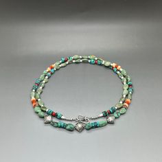 This stunning handcrafted Southwestern inspired mixed gemstone necklace contains high grade, smooth, Genuine green Turquoise nuggets, Turquoise rondelle, orange Spiny Oyster rondelle, Coral, oxidized 925 Sterling Silver beads and spacers finished with solid 925 sterling silver jewelry findings (crimps, crimp covers, wire guards, jump rings, clasp). Each bead in this necklace is hand selected, then strung on professional quality stainless steel bead wire to ensure the best quality. HANDMADE with love, care, and attention to detail by me at my studio in Albuquerque, New Mexico. My studio is smoke-free, and all jewelry is stored in a climate-controlled environment to reduce allergens and tarnishes of materials. * M A T E R I A L * Main stone : Natural Turquoise  Gemstones : 100% genuine Bead Southwestern Turquoise Gemstone Beads Necklace, Green Bohemian Single Strand Jewelry, Bohemian Green Single Strand Jewelry, Handmade Bohemian Turquoise Necklace With Oval Beads, Green Bohemian Single Strand Turquoise Necklace, Bohemian Green Turquoise Gemstone Necklace, Bohemian Green Gemstones For Jewelry Making, Green Bohemian Gemstones For Jewelry Making, Southwestern Green Turquoise Gemstone Necklace