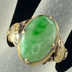 One Antique 14k Yellow Gold Ring, It Four Prong Setting One Natural Green Jadeite Cabochon, 14.6 X 9.62mm, Moss Green Patina, Decorated Etching On The Shanks, A Ring Tension Bar On The Base For Size Adjustment. Ring Top Is 16.3 X 11.2mm, Ring Size 6, Weight 3.6gm, Tested And Hallmark 14k (1 Inch = 25.4 Mm; 1 Dime = 17.9mm). All Items Are Pre-Owned Unless Otherwise Stated. This Means They Have The Usual Aspects Of Pre-Owned Jewelry, Such As Light Scratches, Wear And Tarnish. Please Review All The Photos Which Will Be Part Of The Description. Jr7377 Classic Green Oval Opal Ring, Green Oval Opal Ring, Green Opal Oval Ring In 14k Gold, Heirloom Green Oval Cabochon Rings, Oval Jade Rings Hallmarked, Oval Jade Rings In Yellow Gold, Green Oval Opal Ring For Formal Occasions, Vintage Green Oval Opal Ring, Heirloom Green Oval Opal Ring