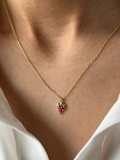 Yummy red strawberry necklace  NEW! Make it custom 🔠 We can engrave an initial or a name to the behind of strawberry pendant Get this beautiful minimalist jewelry made with the quality of perfect elements✨ You can choose 925K Sterling Silver with the options of Gold, Rose Gold or White Gold colors. High quality jewelry for everyone 🤍  Details * 925K Sterling Silver Option → 14K Gold, Rose Gold or White Gold plated * Chain length is approximately 18 inches (16+2 in extender) / 45 cm (40+5 cm extender) * Time is everything! You will receive your package as soon as possible 🚚  * We care about the quality of metal to make sure it will last for a long time * We use enamel technique to color the jewelry and high quality zircons only * There can be tiny differences on each item. Length differe Red Initial Pendant Jewelry As A Gift, Red Initial Pendant Jewelry For Gift, Red Initial Pendant Jewelry Gift, Cute Fruit Design Jewelry As Gift, Cute Fruit Design Jewelry For Gifts, Berry Colored Fruit Design Jewelry Gift, Silver Jewelry With Fruit Design For Gifts, Berry Necklace, Strawberry Jewelry