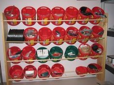 the shelves are filled with buckets and other items