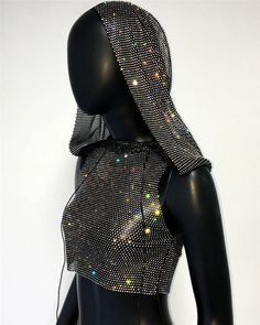 Dazzle the night away in the Sparkly Crystal Sheer Mesh Hooded Camisole—a fashion-forward gem for women who love to make a statement. This sleeveless tank top is a perfect blend of edgy and alluring, designed for the ultimate festival, rave, or nightclub experience. The sheer mesh fabric adds a touch of mystique, while sparkly crystals elevate the glam factor. With a stylish hood for that extra flair, this camisole is the epitome of sexy, chic fashion. Pair it with your favorite festival bottoms Trendy Stretch Vest For Party, Sleeveless Tops For Club In Fall, Winter Party Fitted Tank Top, Trendy Black Party Vest, Fall Party Stretch Tank Top, Fitted Winter Party Tank Top, Fitted Tank Top For Winter Party, Sleeveless Party Tops For Winter, Sleeveless Winter Party Top