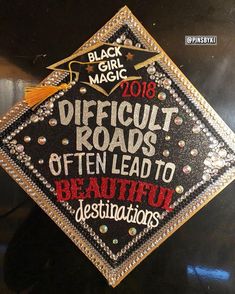 a graduation cap with the words difficult roads often lead to beautiful destinations