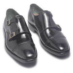 Monk strap shoes for men are one of a kind. Created with a heightened semblance of superior leather and black monk strap finish, it is a pair for everyday wear and is perfect for all occasions. Their appeal lies in their ability to balance the fine line between formal and nonchalant at the same time. In case, at a gathering, you are required to dress sharply but don’t want to look too formal, slip into these shoes. This footwear does not have laces, unlike the traditional lace-up formal shoes. Leather Skin shop’s strapped dress boots are created with extensive attention to detail and are a smart addition to any professional’s closet. With a 6-inch shaft height and a rubber outsole tapped at the back, you can pair these shoes with your formal trousers and shirt to show off your style statem Black Monk Strap Shoes With Brogue Detailing For Galas, Formal Black Monk Strap Shoes With Brogue Detailing, Black Monk Strap Shoes With Brogue Detailing For Formal, Black Patent Leather Monk Strap Shoes For Business, Formal Monk Strap Shoes With Patent Leather, Black Monk Strap Shoes With Leather Sole, Black Monk Strap Shoes With Leather Lining For Galas, Classic Black Monk Strap Shoes With Brogue Detailing, Classic Formal Monk Strap Shoes In Patent Leather