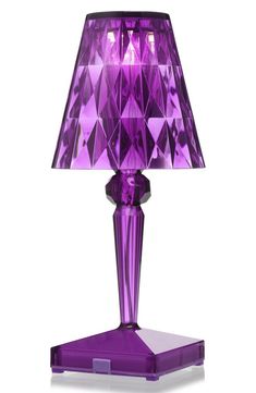 a purple table lamp on a white background