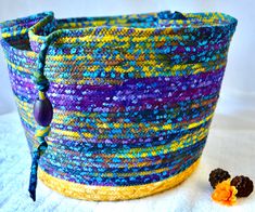 a colorful basket sitting on top of a white table