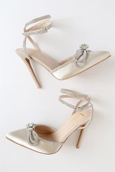 Party season arrived just in time! The Lulus Lullie Ivory Satin Rhinestone Ankle Strap Pointed-Toe Pumps have a sleek satin composition and a pointed-toe upper. Sparkly rhinestones adorn the wrapping adjustable ankle strap and topline, and form a dramatic bow detail on the toe box. 4. 5" wrapped stiletto heel. Cushioned insole. Felted rubber sole has nonskid markings. Man made materials. Imported. Lulus | Lullie Ivory Satin Rhinestone Ankle Strap Pointed-Toe Pumps | Size 10. Glamorous Embellished Satin Heels, Glamorous Cream Heels For Evening, Evening Beige Heels With Rhinestones, Beige Rhinestone Heels For Evening, Cream Rhinestone Party Heels, Cream Rhinestones Party Heels, Cream Embellished Party Heels, Party Cream Embellished Heels, Elegant Beige Heels With Rhinestones