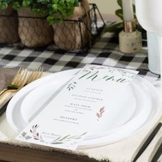 a place setting with white plates and silverware