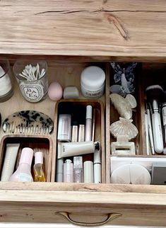 an open drawer filled with lots of beauty products