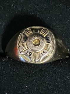 "A truly unique and very old 10K yellow gold class ring for your consideration.  This antique ring is hallmarked 10k and guaranteed to be such.  It has a round top with a decorative standard that features the initials of the school \"OHS\" and the year \"1919\". There is a small circle in the middle with script that has worn.  Buried inside the circle is a star; very unique! The ring is a size 9 and weighs in at 5.23 gram.  What a fabulous piece of history that has survived 104 years!" Gold Class, Small Circle, Antique Ring, Round Top, The Circle, Antique Rings, Fort Worth, The School, Class Ring