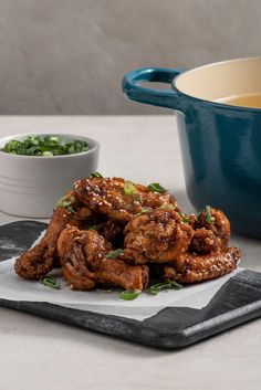 some food is sitting on a plate next to a bowl