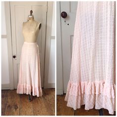 This lovely skirt is pink in color and features a cream plaid pattern throughout. I believe it is made of cotton. The cream plaid portion has a seersucker like texture. Metal hook and eye closures at the side. White cotton trim on inside waist. Pretty, ruffle trim at the hem. This would best fit a size small.  Condition: This antique beauty was well worn & loved. There are pinholes/small holes throughout the entire skirt/ruffle trim. They are primarily scattered throughout the skirt, but a good Ruffle Trim Skirt, Pink Plaid Skirt, Texture Metal, Skirt Ruffle, Plaid Skirt, Pink Plaid, Plaid Skirts, Dream Clothes, Dream Wardrobe