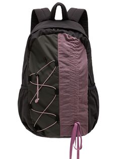 a black and purple backpack with pink stringing on the front, two straps at the bottom