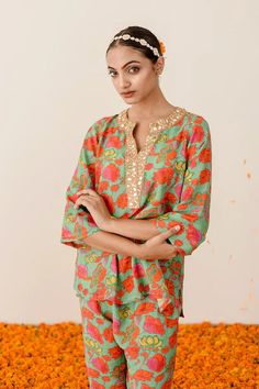 Welcome the new season with style and comfort, courtesy of our Green Floral Printed Muslin Co-Ord Set. Drawing inspiration from desi fashion, this chic set in a breezy green shade has all the makings of a luxurious outfit that will take you from brunch dates with friends to a day of shopping in total comfort. Crafted in muslin fabric, it'll be your go-to pick for effortlessly fashionable looks. No. of pieces : 2 piece set Color : Green Fabric : Muslin Top Length : 26-28 inches Pant Length : 38 i Green Long Sleeve Sets For Spring, Green Long Sleeve Spring Sets, Green Long Sleeve Summer Sets, Green Floral Print Pant Set For Spring, Green Matching Set Tops For Spring, Spring Matching Green Pant Set, Spring Green Matching Pant Set, Festive Summer Straight Kurta Pant Set, Summer Festive Green Sharara