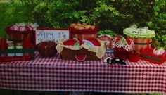 a picnic table with food and decorations on it