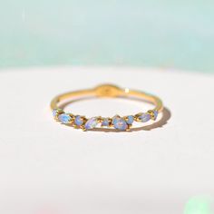 We've taken a special baby blue twist on our best selling Lily Ring. Made with love, each stone in our Blue Lily Ring is embedded by hand, making each piece one of a kind. Wear it alone or pair it with your other rings to create the perfect #GCstack 18k gold plated, 18k rose gold plated, or rhodium plated over brass wi Senior Rings, Lily Ring, Celestial Ring, Blue Lily, Necklace Chain Lengths, Pink Ring, Wrap Rings, Brass Pendant, Jewelry Companies