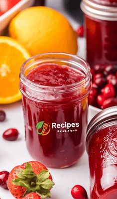 cranberry sauce in a glass jar next to oranges and pomegranate