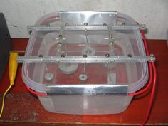 a plastic container with some wires attached to it