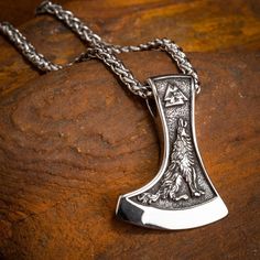 A striking double-sided necklace in 316L Stainless Steel and matching wheat chain. Design features a Valknut symbol and a flying Raven on one side and a howling Wolf on the other. Pendant dimensions: approx 1.7" x 1.18" ( 4.3 x 3cm) Chain length approx 23.5" ( 60cm ) Handmade Viking Style Jewelry For Outdoor, Viking Style Sterling Silver Round Pendant Jewelry, Viking Style Sterling Silver Pendant Jewelry, Viking Sterling Silver Pendant Jewelry, Viking Style Sterling Silver Pendant, Viking Style Stainless Steel Necklace For Gift, Adjustable Viking Style Jewelry Gift, Viking Style Sterling Silver Nickel-free Necklace, Viking Pendant Jewelry Gift