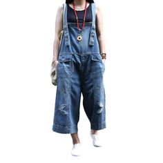 Introducing our street-trend baggy. ripped. suspenders closure denim jumpsuit from the 2023 Spring-Summer Collection ââ‚?a fierce expression of urban chic!Why They're Your Next Wardrobe EssentialThis denim jumpsuit has been expertly crafted to combine modern fashion with classic grunge vibe. Featuring a torn pattern. baggy fit. and adjustable suspenders. it's not just a jumpsuit; it's an attitude. a statement. a vibe!Key Highlights: Urban Cool: Combining streetwear with classic elegance. this ju Classic Grunge, Womens Denim Jumpsuit, Ripped Women, Denim Dungaree, Jumpsuit Online, Current Trends, Street Trends, Style Clothes, Street Style Chic