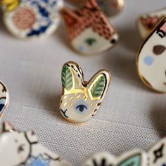 a close up of many different shaped objects on a table with one animal in the middle