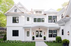 a large white house with two story windows