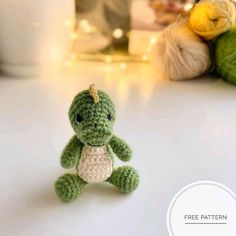 a small crocheted turtle sitting on top of a table