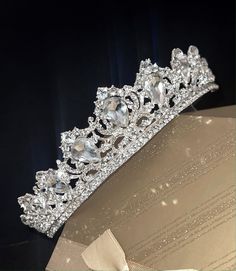 Meet Princess Carla, The perfect wedding tiara, classic tradition encrusted vines with bold center crystal creates the perfect look for your contemporary, yet classic and romantic wedding Measures approx 1.25" high with combs limited stock **************************************************Note processing time is not shipping time, our regular Free shipping takes approx. 5-6 days to receive after shipped.With rush processing your order is expedited and upgraded to priority mail approx 2-3 days to Princess Wedding Tiara, Wedding Veil Tiara, Princess Aesthetic Tiara, Crown Wedding Veil, Princess Wedding Veil With Crown, Wedding Tiara Veil Princesses, Quince Tiaras, Diamond Tiara Aesthetic, Medical Scientist