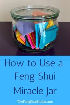 a glass jar filled with colorful paper and the words how to use a feng shui