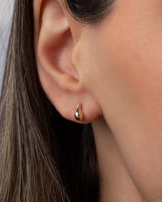 A mini version of a popular stud, these 14K Gold Mini Teardrop Stud Earrings add a touch of luxury to any ear stack. From a strapless gown to a classic white tee, these earrings elevate your style with their curvaceous, mini bubbly design. Effortless and feminine, they are a trendy must-have for the fashion-forward woman. Size: Approx. 3.46mm(W) x 7.6mm(H) Total Weight: Approx. .76 grams (per pair) Standard Production: 3-5 business days Rush Order Production: 2-3 business days Shipping: Select s Timeless Teardrop Huggie Earrings For Gift, Timeless Teardrop Huggie Earrings As Gift, Timeless Teardrop Huggie Earrings, Classic Teardrop Huggie Earrings For Gift, Hypoallergenic Teardrop 14k Gold Huggie Earrings, Hypoallergenic 14k Gold Teardrop Huggie Earrings, Hypoallergenic Teardrop Huggie Earrings In 14k Gold, Formal 14k Gold Teardrop Huggie Earrings, Minimalist 14k Gold Teardrop Huggie Earrings