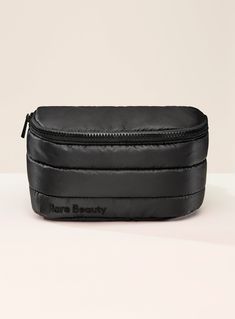 A stylish and spacious belt bag in a classic black color perfect for storing all your daily and makeup essentials. Functional Black Belt Bag For On-the-go, Black Travel Pouch With Detachable Strap, Trendy Black Camera Bag For Travel, Trendy Black Camera Bag For On-the-go, Chic Black Travel Bag With Detachable Strap, Chic Black Pouch For On-the-go, Chic Pouch Bag With Removable Belt, Trendy Black Camera Bag With Removable Pouch, Versatile Black Pouch Cosmetic Bag