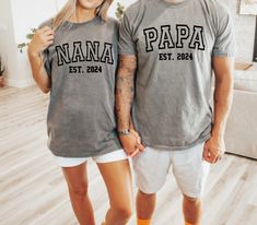 Mother's Day Grandma, Father's Day Grandpa Gift, Nana Papa Comfort Colors Tees! Collegiate Font Shirts, New grandparents Couple Matching Tees, Hospital Family Coming Home, Baby Announcement, Pregnancy Reveal Shirt, Baby Shower Gifts, Family Photos, Gift for Dad, Gift for Mom Each shirt sold separately! Choose from 12 different colors. Sizes Small, Medium, Large, XL, 2XL available. Heat pressed with heat transfer vinyl. Matching Letter Print Tops For Family Events, Family Matching Gray Tops With Letter Print, Gray Family Matching Tops With Letter Print, Gray Tops With Letter Print For Family Matching, Cotton Tops With Name Print For Family Events, Gender Reveal Shirts For Grandparents, Matching Crew Neck Tops For Family Events, Crew Neck Tops With Letter Print For Family Events, Family Events Letter Print Crew Neck Shirt