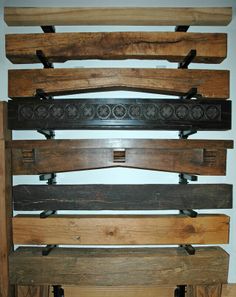 several wooden boards stacked on top of each other in the same direction, with metal brackets attached to them