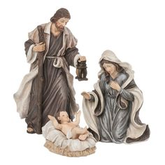 two figurines of jesus and mary with baby jesus in manger scene on white background