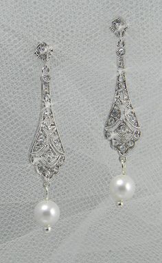 Earrings Ornate Bridal Earrings For Festive Occasions, Ornate Bridal Earrings For Formal Occasions, Teardrop Jewelry With Intricate Design For Wedding, White Intricate Design Drop Earrings, Teardrop Wedding Jewelry With Intricate Design, White Intricate Design Dangle Earrings, Silver Pearl Drop Earrings With Intricate Design, Elegant Filigree Dangle Jewelry, Teardrop Filigree Jewelry For Weddings