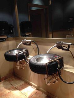 two black tires sitting on top of a sink